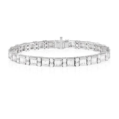 125 - A DIAMOND LINE BRACELET  Composed of a series of channel-set baguette-cut diamonds, interspersed wit... 