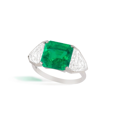 127 - LANGI: AN IMPRESSIVE EMERALD AND DIAMOND RING  Centring an octagonal step-cut emerald weighing 4.36c... 