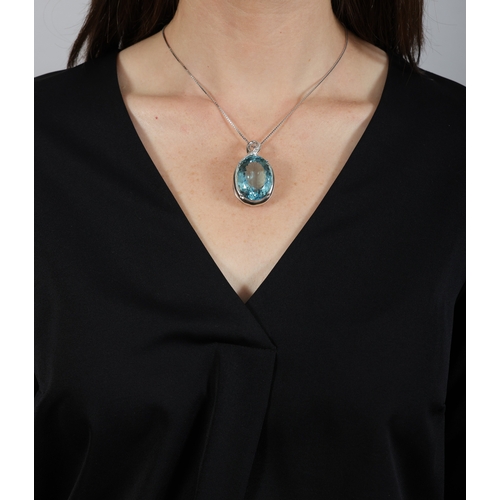 137 - A LARGE AQUAMARINE AND DIAMOND PENDANT ON CHAIN  The oval-shaped aquamarine weighing approximately 5... 