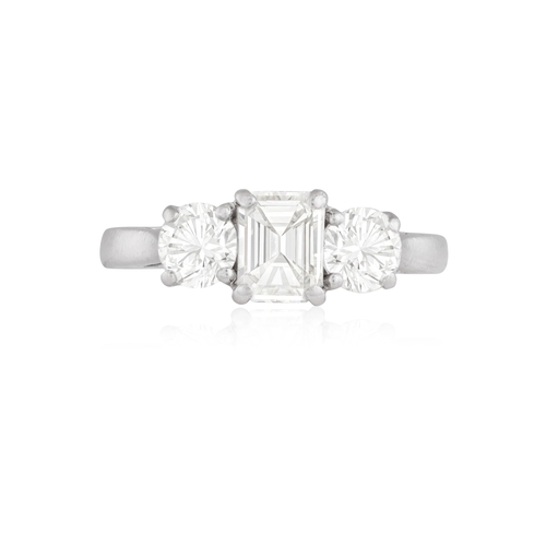 142 - A DIAMOND THREE-STONE RING  The cut-cornered rectangular-cut diamond at the centre between two brill... 