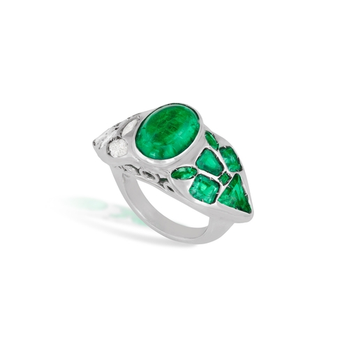 150 - AN EMERALD AND DIAMOND DRESS RING  The central oval-shaped emerald cabochon weighing approximately 5... 