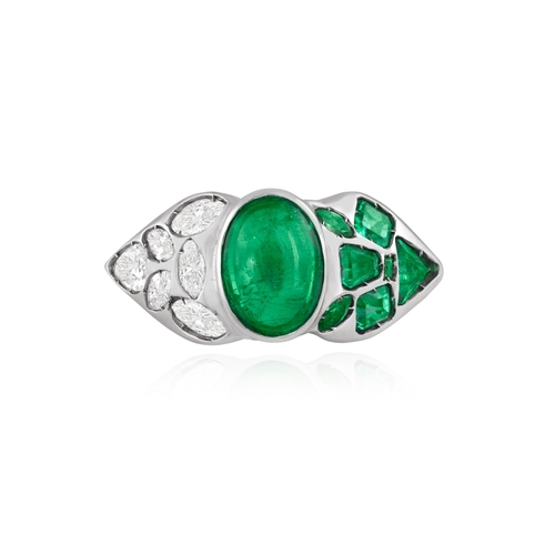 150 - AN EMERALD AND DIAMOND DRESS RING  The central oval-shaped emerald cabochon weighing approximately 5... 