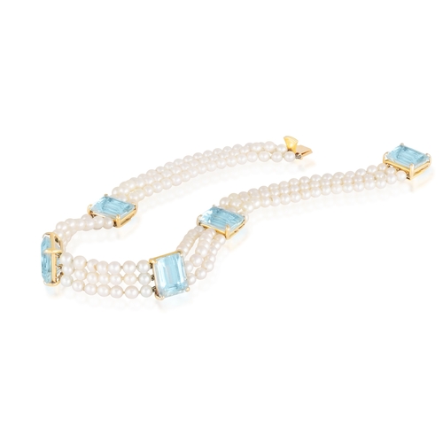 163 - AN AQUAMARINE AND CULTURED PEARL CHOKER NECKLACE  Composed of three rows of cultured pearls, the fro... 