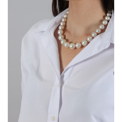 166 - A CULTURED PEARL NECKLACE  Composed of a single strand of graduated South Sea pearls measuring appro... 