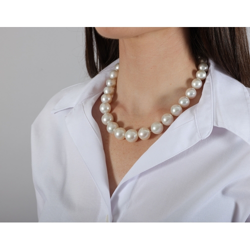 166 - A CULTURED PEARL NECKLACE  Composed of a single strand of graduated South Sea pearls measuring appro... 