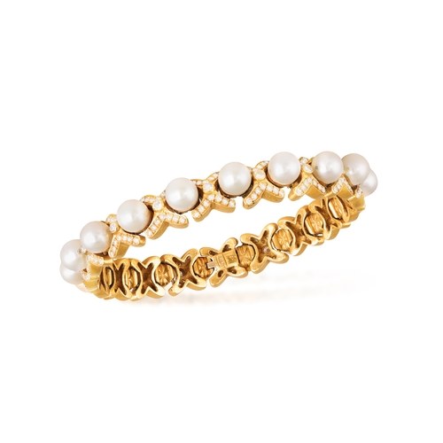 171 - A CULTURED PEARL AND DIAMOND BRACELET  The articulated bracelet set with a line of cultured pearl be... 