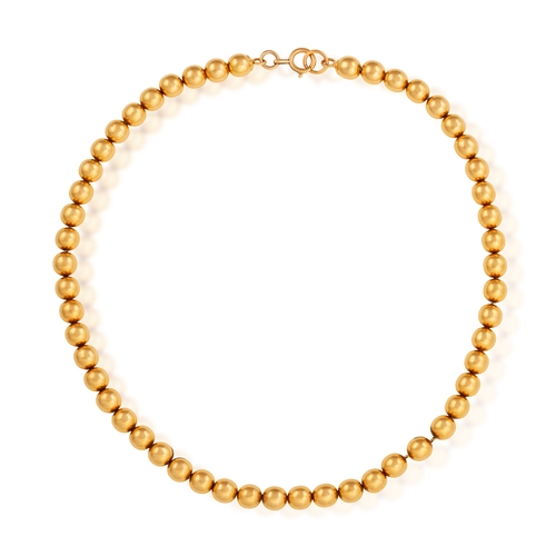 174 - A GOLD BEAD NECKLACE  Composed of a fancy-link chain suspending a series of gold beads throughout, i... 