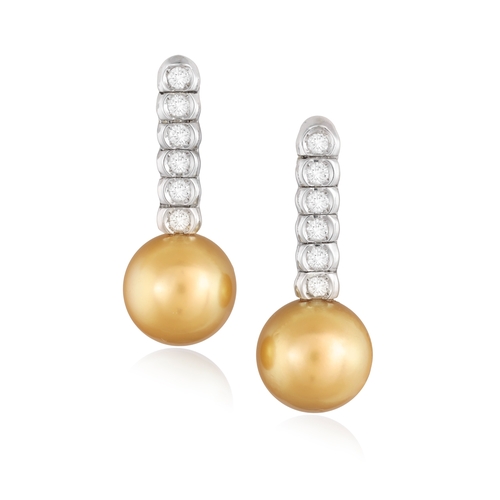 183 - A PAIR OF CULTURED PEARL AND DIAMOND EARRINGS  Each cultured South Sea pearl of gold tint measuring ... 