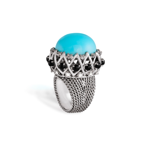 189 - A TURQUOISE AND DIAMOND COCKTAIL RING  Set with an oval-shaped turquoise cabochon at the centre with... 