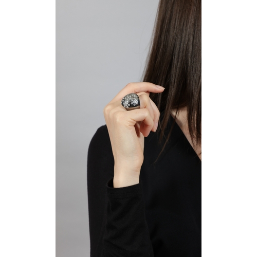 207 - A DIAMOND COCKTAIL RING  Of bombé design, set with brilliant-cut diamonds within collet-setting, mou... 