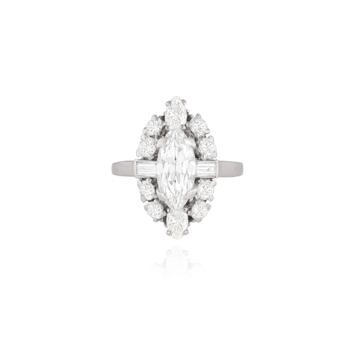 210 - A DIAMOND DRESS RING  The central old marquise-cut diamond weighing approximately 1.15cts, within a ... 