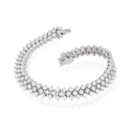 213 - A DIAMOND BRACELET  Composed of three articulated rows of brilliant-cut diamonds, mounted in 18K gol... 