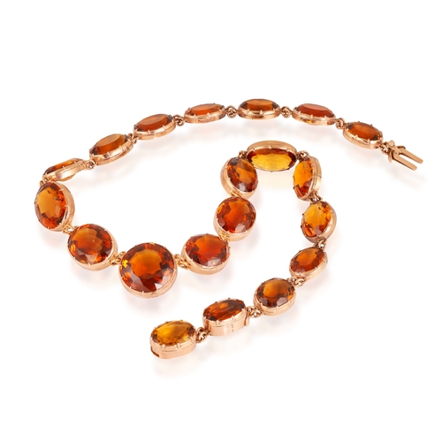 25 - AN IMPORTANT LATE 19TH CENTURY RIVIÈRE NECKLACE, CIRCA 1880  Centring a circular-cut citrine weighin... 