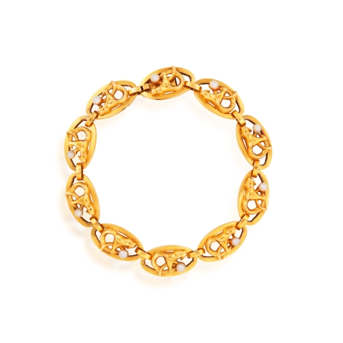 32 - AN ART NOUVEAU GOLD AND SEED PEARL BRACELET, CIRCA 1900  Composed of a series of openwork oval links... 