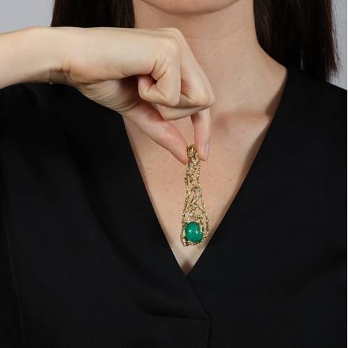 46 - AN EMERALD AND DIAMOND PENDANT  Of openwork abstract design, the texted gold pendant centring an ova... 