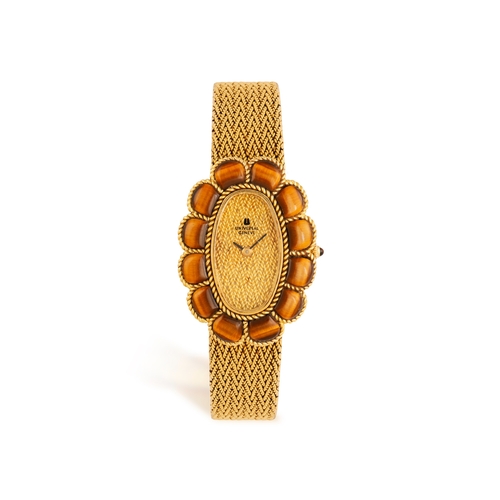 51 - UNIVERSAL: A LADY'S TIGER'S EYE AND 18K GOLD COCKTAIL WATCH, CIRCA 1965  Of 17-jewels manual movemen... 