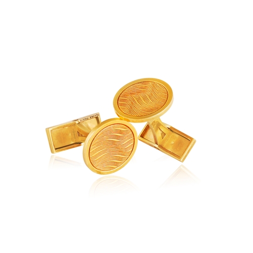 52 - HERMÈS: A PAIR OF GOLD CUFFLINKS  Each circular textured and polished plaque, with T-bar terminal, i... 