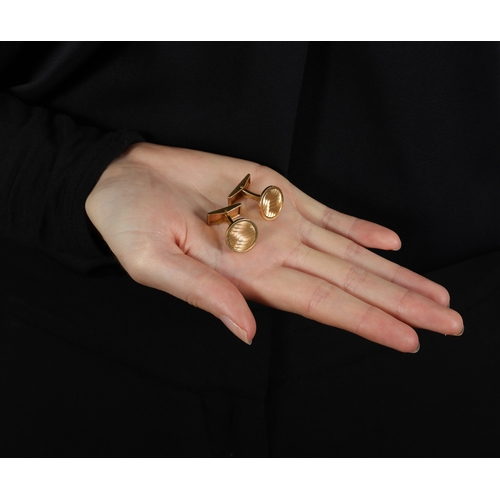 52 - HERMÈS: A PAIR OF GOLD CUFFLINKS  Each circular textured and polished plaque, with T-bar terminal, i... 