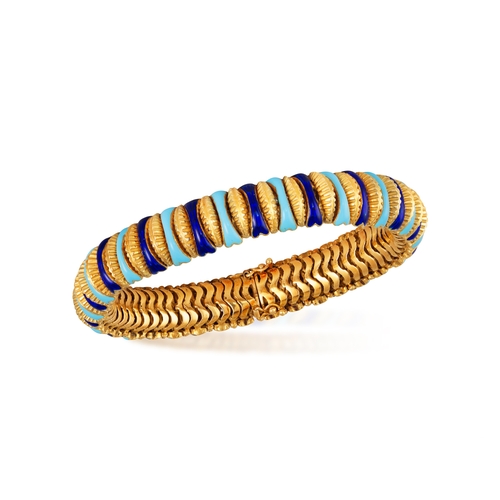 67 - AN ENAMEL AND GOLD BRACELET  The articulated bracelet embellished with stripes of turquoise and blue... 