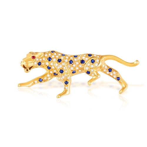 74 - BUCHERER: A GEM-SET AND DIAMOND-SET LEOPOARD BROOCH  Designed as a hunting leopard, the body pavé-se... 