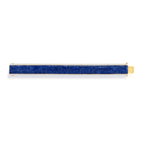 75 - A SAPPHIRE AND DIAMOND BRACELET  Designed as a flexible strap of calibré-cut sapphires, bordered by ... 