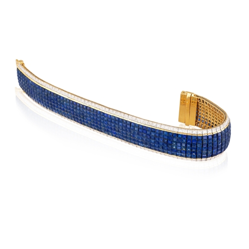 75 - A SAPPHIRE AND DIAMOND BRACELET  Designed as a flexible strap of calibré-cut sapphires, bordered by ... 