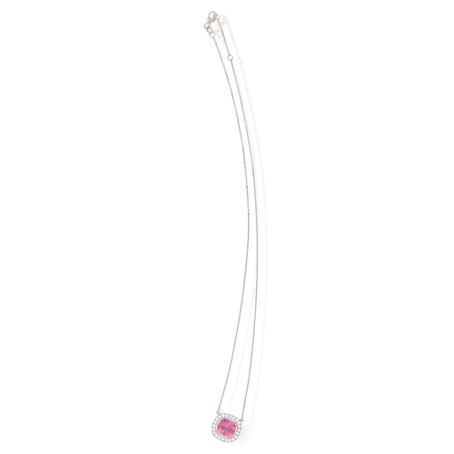 79 - A TOURMALINE AND DIAMOND PENDANT NECKLACE  The cushion-shaped tourmaline weighing approximately 4.55... 