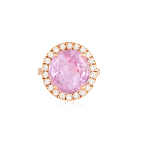 81 - A SAPPHIRE AND DIAMOND DRESS RING  The central oval-shaped pink sapphire weighing 9.86cts, within a ... 