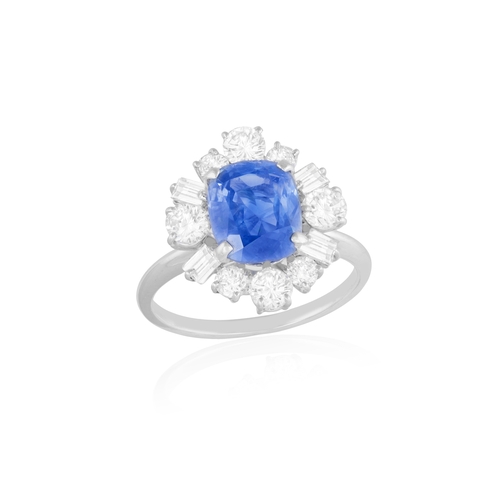 88 - A SAPPHIRE AND DIAMOND CLUSTER RING  The cushion-shaped sapphire weighing approximately 3.50cts, wit... 