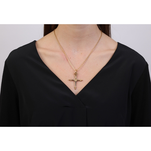 101 - A GOLD PENDANT ON CHAIN  The cross pendant with engraving and beading detailing, with suspension loo... 