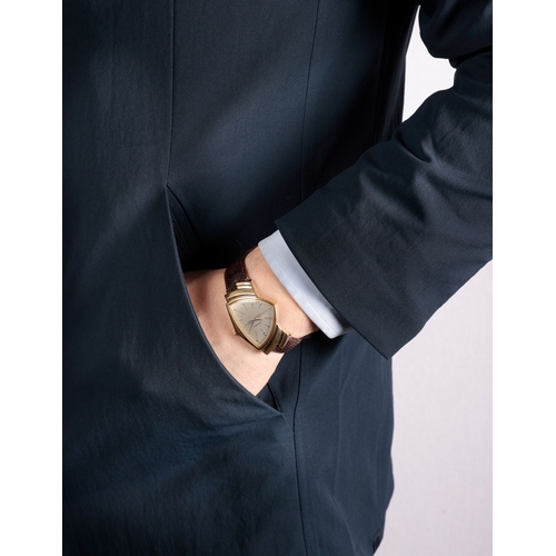 110 - HAMILTON: A GILT AND STAINLESS STEEL QUARTZ WRISTWATCH  Quartz movement, the fancy-shaped silver dia... 