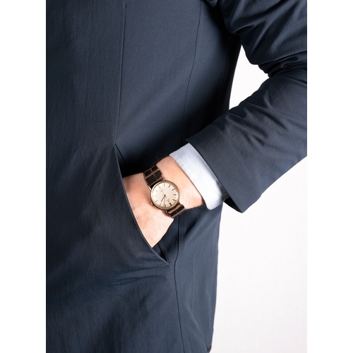 116 - OMEGA: A MECHANICAL ‘GENÉVE’ BRACELET WATCH  Mechanical movement, the circular silver dial with bato... 