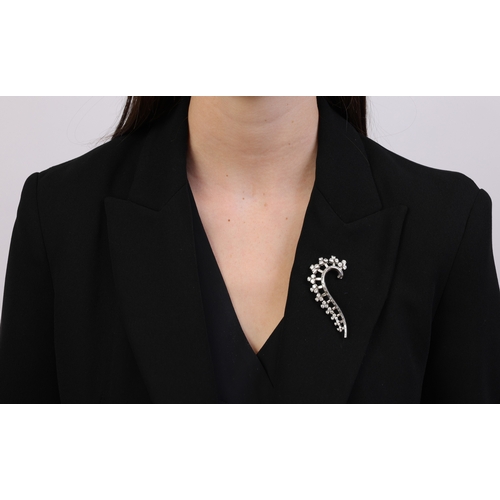 73 - A FINE DIAMOND BROOCH, CIRCA 1930  Of scrolled design, set with graduated clusters composed of brill... 
