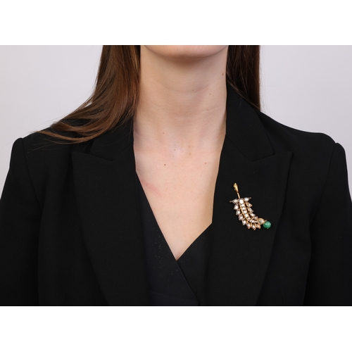 88 - AN INDIAN EMERALD, ENAMEL AND DIAMOND PENDANT  The pendant of openwork foliate design, set with foil... 