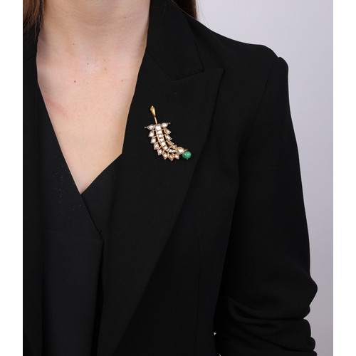 88 - AN INDIAN EMERALD, ENAMEL AND DIAMOND PENDANT  The pendant of openwork foliate design, set with foil... 