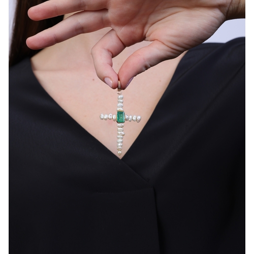 90 - A FRESHWATER CULTURED PEARL AND EMERALD CROSS PENDANT  The cross set with freshwater cultured pearls... 