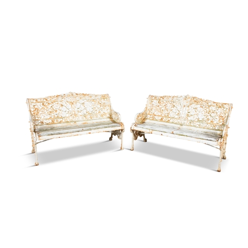 312 - A PAIR OF WHITE PAINTED GARDEN SEATS WITH CONVULUS FLOWER DECORATED BACKS,   with timber slatted sea... 