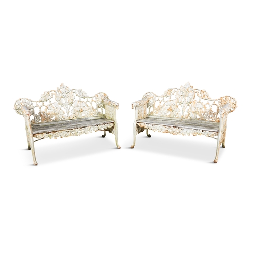 313 - A PAIR OF VICTORIAN CAST IRON GARDEN BENCHES ATTRIBUTED TO COALBROOKEDALE,   the pierced back decora... 