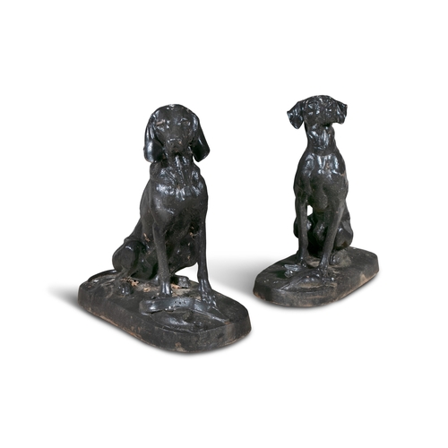 316 - A PAIR OF BLACK PAINTED CAST IRON HOUNDS,   both seated, one with game at its feet, the other with a... 