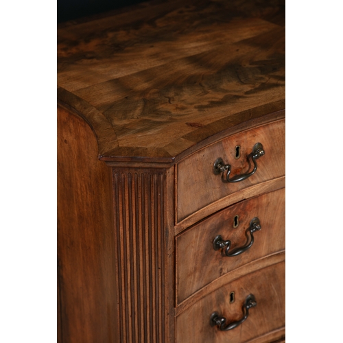 320 - A GEORGE III MAHOGANY SERPENTINE KNEEHOLE DESK C.1760,   the shaped quarter veneer top above an arra... 