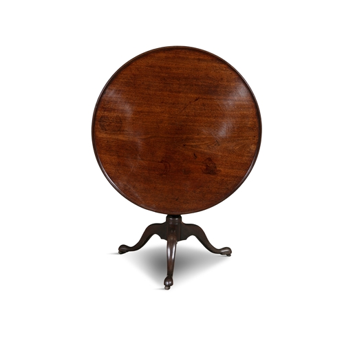 329 - A GEORGE III MAHOGANY TILT TOP WINE TABLE,   the circular dished top, on bird cage action and raised... 