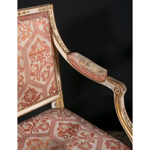 334 - A SET OF FOUR GEORGE III CREAM AND PARCEL GILT OPEN ARMCHAIRS CIRCA 1780,    each rectangular back a... 