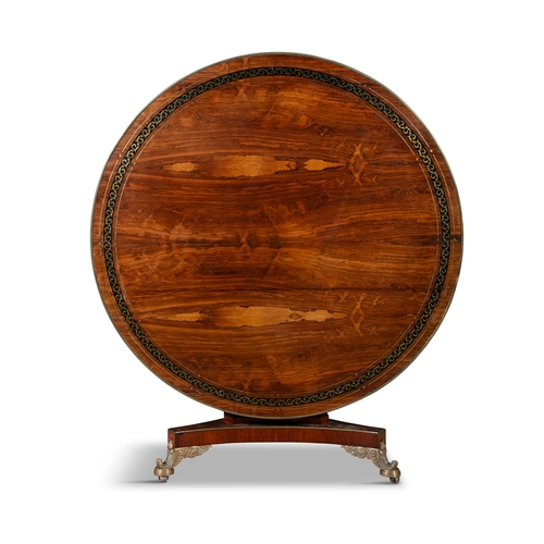 336 - A REGENCY EBONY INLAID MAHOGANY ROSEWOOD CIRCULAR BREAKFAST TABLE,  decorated with brass scrolls on ... 