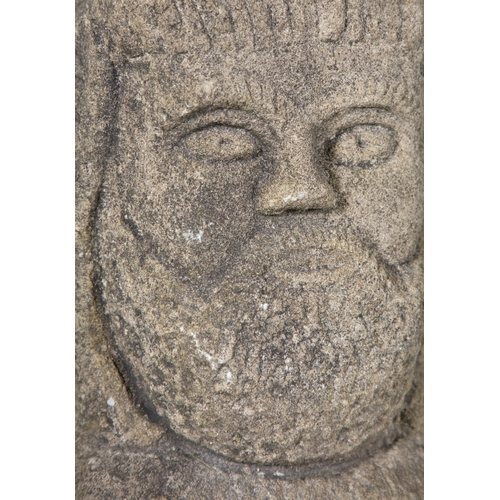 337 - THE CAVAN HEAD,  an Irish limestone carving of a male head, bearded, with arched brows and counter s... 