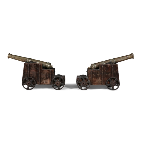 345 - A PAIR OF BRASS SIGNAL CANNONS ON TIMBER CARRIAGES,   c.65cm long; barrel 49cm long