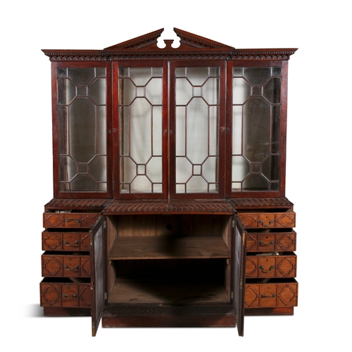 354 - A GEORGE III MAHOGANY BREAKFRONT BOOKCASE,   the moulded cornice surmounted by a pierced scrollwork ... 