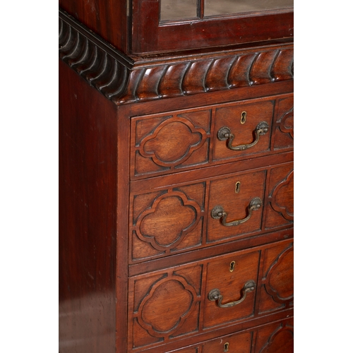 354 - A GEORGE III MAHOGANY BREAKFRONT BOOKCASE,   the moulded cornice surmounted by a pierced scrollwork ... 