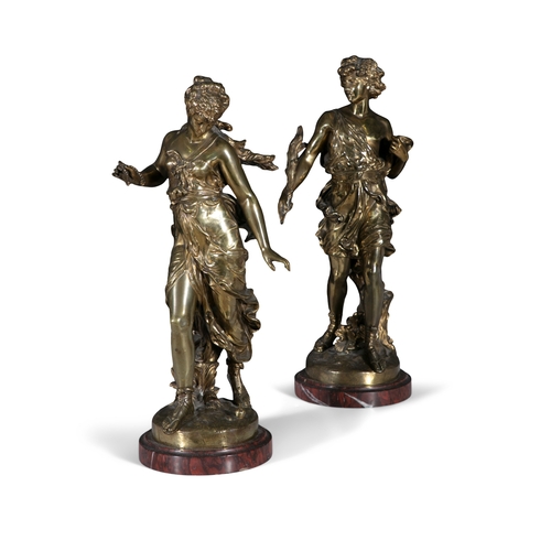 359 - AFTER AUGUSTE MOREAU (FRENCH, 1834 -1917) A pair of gilt brass figures on marble bases, 62cm high