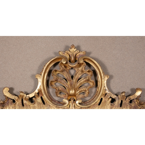 368 - A GEORGE III RECTANGULAR GILTWOOD MIRROR CIRCA 1770,   the shaped plate surrounded by carved rockwor... 