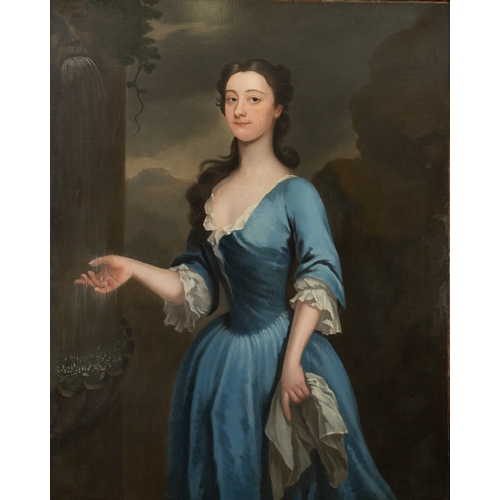 370 - MANNER OF CHARLES JERVAS (1675 - 1739) Portrait of a Young Lady in a Blue dress, standing by a fount... 